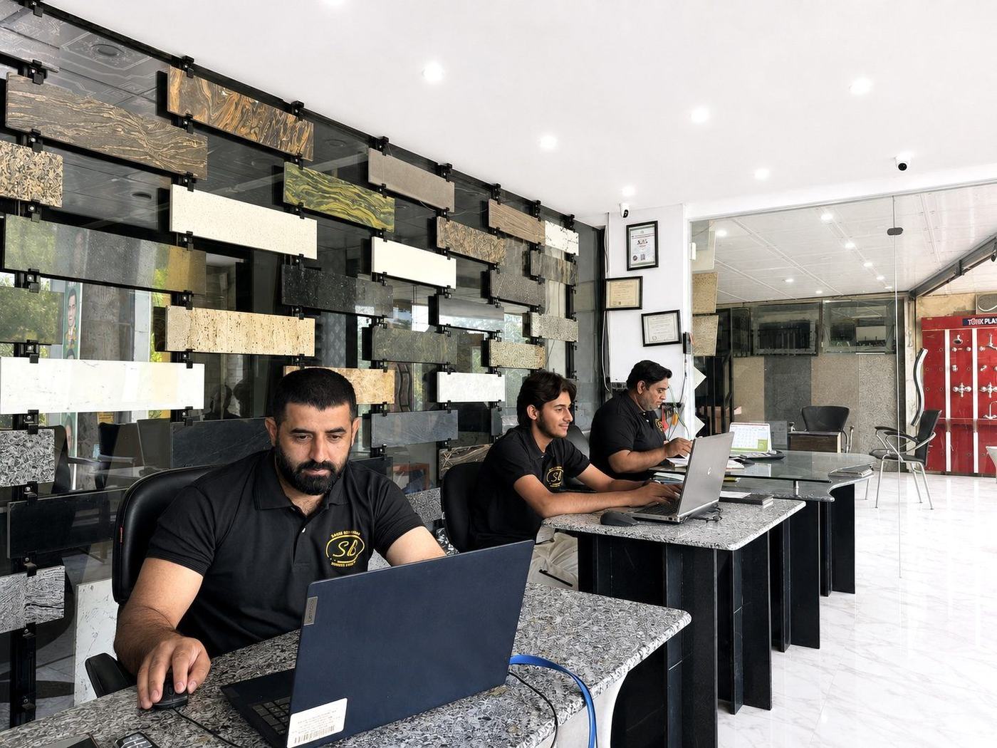 The Saqib Brothers team at work in the stone-clad office